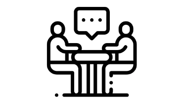 Two people sitting at a desk talking icon