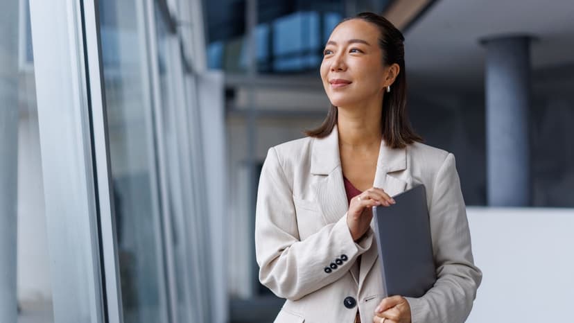 singapore woman standing with laptop
