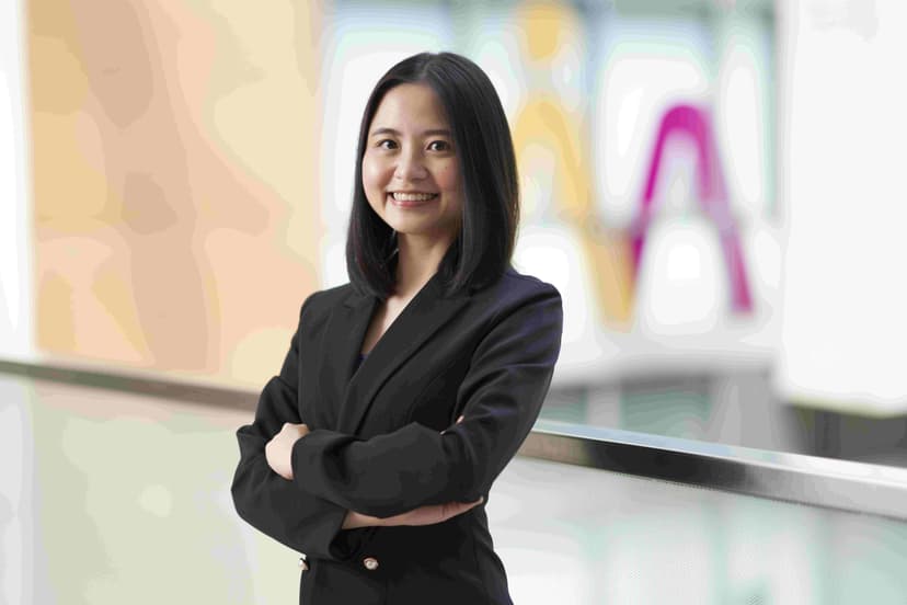women in suit with arms crossed